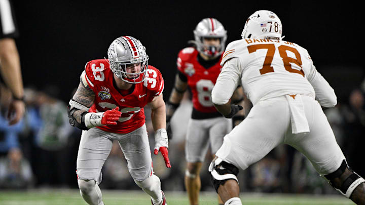 Jan 10, 2025; Arlington, TX, USA; Ohio State Buckeyes defensive end Jack Sawyer (33) rushes against Texas Longhorns offensive lineman Kelvin Banks Jr. (78) during the game at AT&T Stadium. Mandatory Credit: Jerome Miron-Imagn Images Jan 10, 2025; Arlington, TX, USA; Ohio State Buckeyes defensive end Jack Sawyer (33) rushes against Texas Longhorns offensive lineman Kelvin Banks Jr. (78) during the game at AT&T Stadium. Mandatory Credit: Jerome Miron-Imagn Images