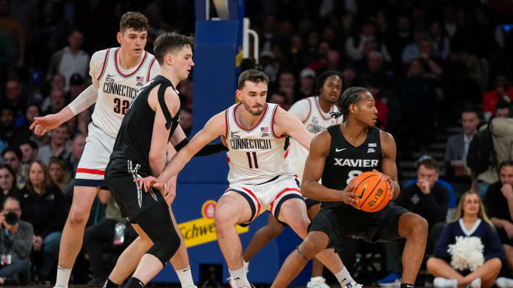 Xavier Musketeers guard Quincy Olivari (8) drives in the second half of the NCAA Big East Conference Tournament second round game between the Connecticut Huskies and the Xavier Musketeers at Madison Square Garden in New York City on Thursday, March 14, 2024. Xavier was eliminated from the tournament by a 87-60 loss to UConn.