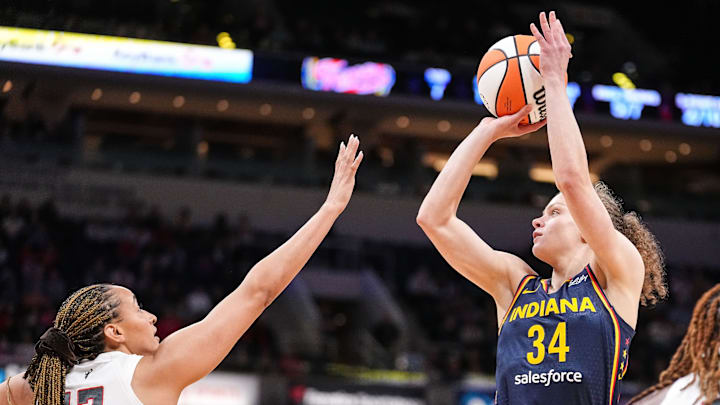 Indiana Fever guard Grace Berger (34) shoots the ball against Atlanta Dream guard Haley Jones (13). Indiana Fever guard Grace Berger (34) shoots the ball against Atlanta Dream guard Haley Jones (13).