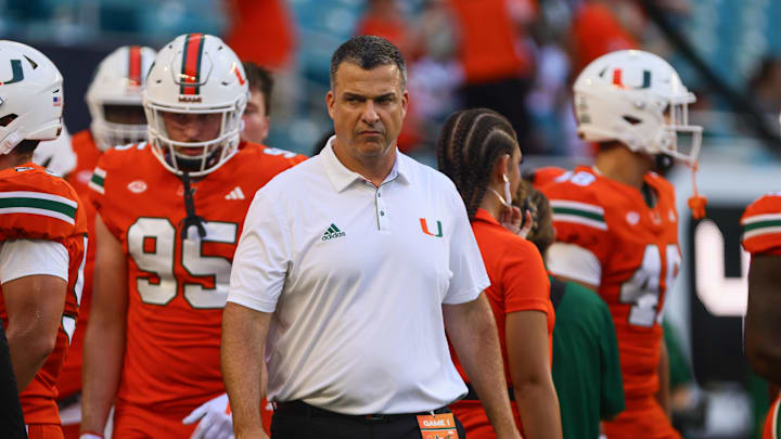 Sep 7, 2024; Miami Gardens, Florida, USA; Miami Hurricanes head coach Mario Cristobal walks on the field before the game against the Florida A&M Rattlers at Hard Rock Stadium. Mandatory Credit: Sam Navarro-Imagn Images