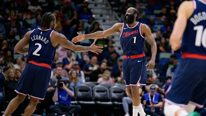 Mar 11, 2025; New Orleans, Louisiana, USA; Los Angeles Clippers forward Kawhi Leonard (2) and Los Angeles Clippers guard James Harden (1) react  during the second half against the New Orleans Pelicans at Smoothie King Center. Mandatory Credit: Matthew Hinton-Imagn Images