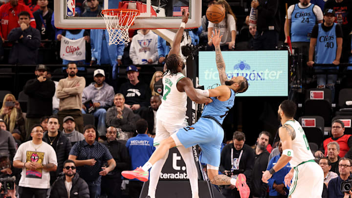 Jan 22, 2025; Inglewood, California, USA; LA Clippers guard Amir Coffey (7) makes a shot while being fouled by Boston Celtics guard Jaylen Brown (7) during overtime at Intuit Dome. Mandatory Credit: Jason Parkhurst-Imagn Images