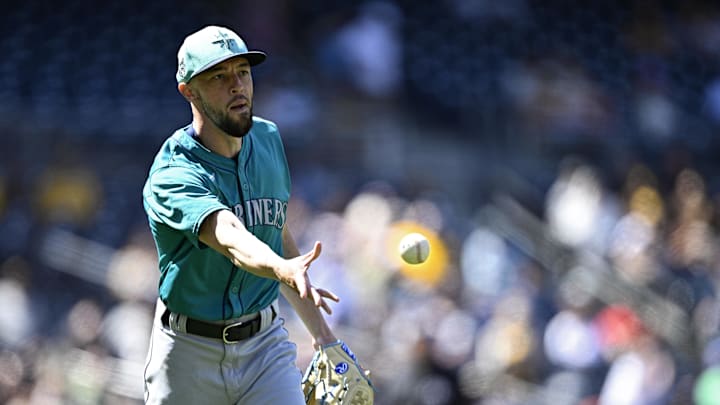 Seattle Mariners starting pitcher Casey Lawrence (96) tosses the ball to first base during the fourth inning against the San Diego Padres at Petco Park. Seattle Mariners starting pitcher Casey Lawrence (96) tosses the ball to first base during the fourth inning against the San Diego Padres at Petco Park.