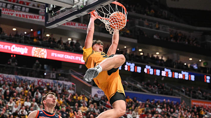 Dec 20, 2025; Iowa City, Iowa, USA; Iowa Hawkeyes guard Isaia Howard (23) dunks as Bucknell Bison guard Achile Spadone (24) defends during the first half at Casey’s Center. Mandatory Credit: Jeffrey Becker-Imagn Images Dec 20, 2025; Iowa City, Iowa, USA; Iowa Hawkeyes guard Isaia Howard (23) dunks as Bucknell Bison guard Achile Spadone (24) defends during the first half at Casey’s Center. Mandatory Credit: Jeffrey Becker-Imagn Images