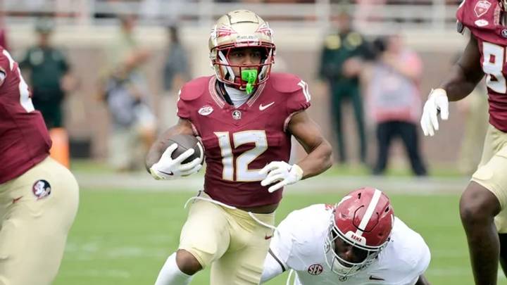 Jaylin Lucas (12) runs the ball against southern opponent, Alabama. Jaylin Lucas (12) runs the ball against southern opponent, Alabama.