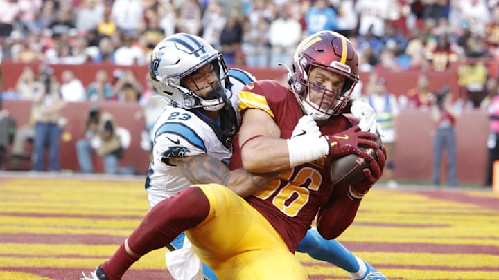 Oct 20, 2024; Landover, Maryland, USA; Washington Commanders tight end Zach Ertz (86) catches a touchdown pass as Carolina Panthers cornerback Dane Jackson (23) defends during the second quarter at Northwest Stadium. Mandatory Credit: Amber Searls-Imagn Images