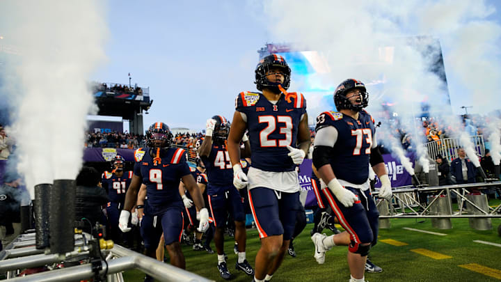 Illinois players take the field for the Music City Bowl against Tennessee for an NCAA football game on Dec. 30, 2025, in Nashville, Tennessee.