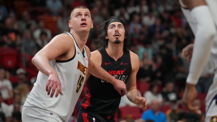 Mar 13, 2024; Miami, Florida, USA;  Denver Nuggets center Nikola Jokic (15) looks on against Miami Heat guard Jaime Jaquez Jr. (11) during a free throw in second half at Kaseya Center. Mandatory Credit: Jim Rassol-USA TODAY Sports