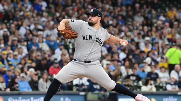 New York Yankees starting pitcher Carlos Rodon (55) throws a pitch in the first inning against the Milwaukee Brewers at American Family Field.