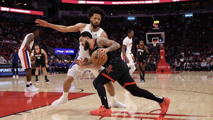 Jan 20, 2025; Houston, Texas, USA; Houston Rockets guard Fred VanVleet (5) dribbles against Detroit Pistons guard Cade Cunningham (2) in the first quarter at Toyota Center. Mandatory Credit: Thomas Shea-Imagn Images