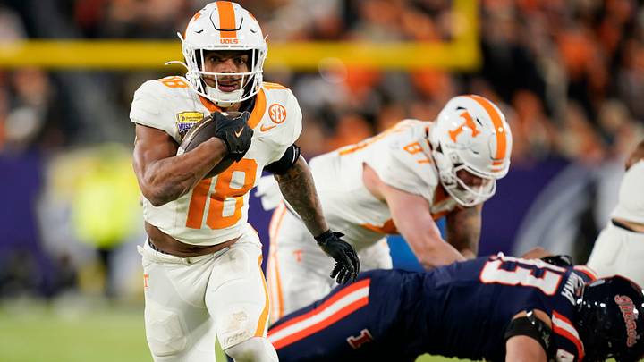 Tennessee running back DeSean Bishop (18) runs the ball in the first quarter of the Music City Bowl against Illinois in an NCAA college football game on Dec. 30, 2025, in Nashville, Tennessee. Tennessee running back DeSean Bishop (18) runs the ball in the first quarter of the Music City Bowl against Illinois in an NCAA college football game on Dec. 30, 2025, in Nashville, Tennessee.
