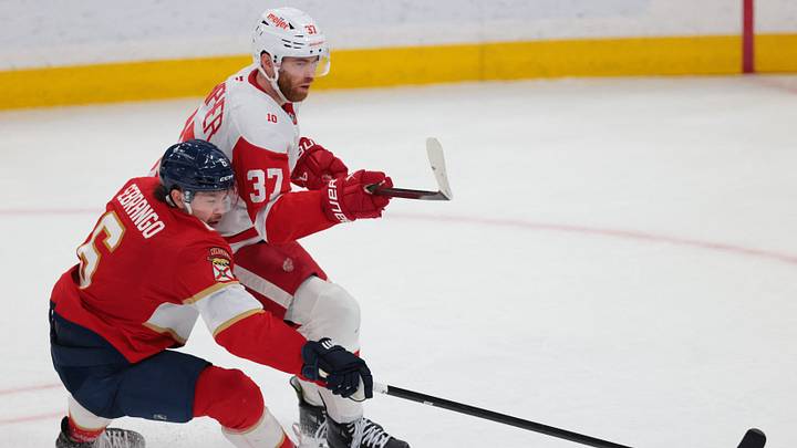 Apr 15, 2026; Sunrise, Florida, USA; Detroit Red Wings left wing J.T. Compher (37) protects the puck against Florida Panthers defenseman Donovan Sebrango (6) during the third period at Amerant Bank Arena. Mandatory Credit: Sam Navarro-Imagn Images Apr 15, 2026; Sunrise, Florida, USA; Detroit Red Wings left wing J.T. Compher (37) protects the puck against Florida Panthers defenseman Donovan Sebrango (6) during the third period at Amerant Bank Arena. Mandatory Credit: Sam Navarro-Imagn Images