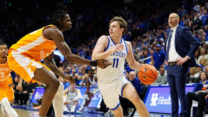 Feb 11, 2025; Lexington, Kentucky, USA; Kentucky Wildcats guard Travis Perry (11) drives to the basket against Tennessee Volunteers forward Felix Okpara (34) during the second half at Rupp Arena at Central Bank Center. Mandatory Credit: Jordan Prather-Imagn Images