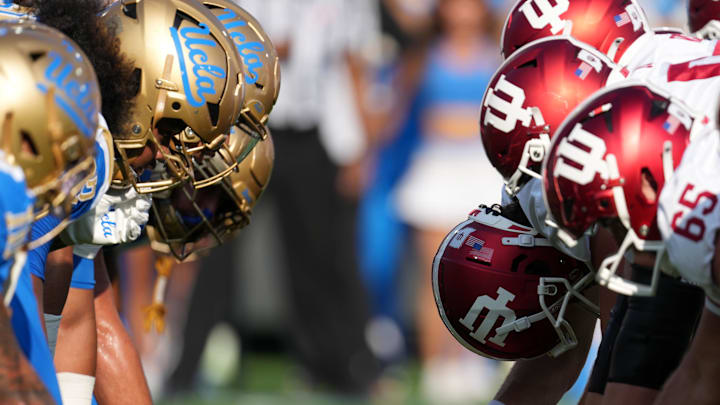 Sep 14, 2024; Pasadena, California, USA; UCLA Bruins and Indiana Hoosiers helmets at the line of scrimmage during the game at Rose Bowl. Mandatory Credit: Kirby Lee-Imagn Images Sep 14, 2024; Pasadena, California, USA; UCLA Bruins and Indiana Hoosiers helmets at the line of scrimmage during the game at Rose Bowl. Mandatory Credit: Kirby Lee-Imagn Images