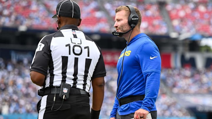 Sep 14, 2025; Nashville, Tennessee, USA;  Los Angeles Rams head coach Sean McVay talks with line judge Carl Johnson (101) about throwing the challenge flag against the Tennessee Titans during the second half at Nissan Stadium. Mandatory Credit: Steve Roberts-Imagn Images