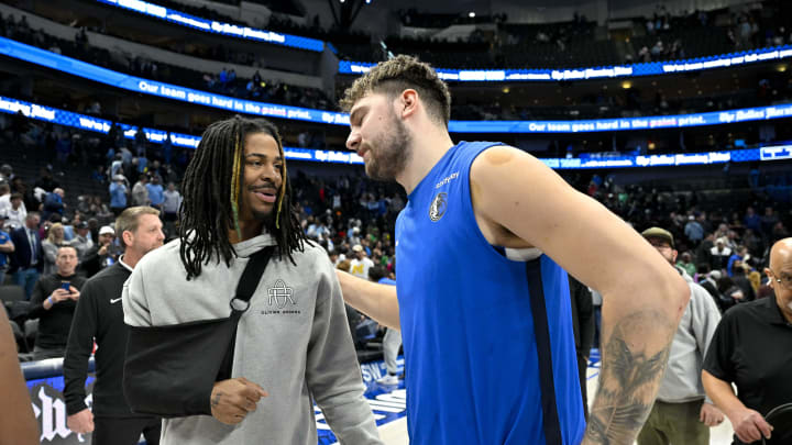 Jan 9, 2024; Dallas, Texas, USA; Memphis Grizzlies guard Ja Morant (left) talks with Dallas Mavericks guard Luka Doncic (right) after Memphis defeats Dallas at the American Airlines Center. Mandatory Credit: Jerome Miron-USA TODAY Sports