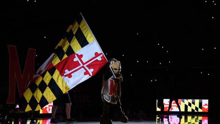 Dec 28, 2024; College Park, Maryland, USA; Maryland Terrapins mascot waves a flag before the game between the Maryland Terrapins and the Maryland-Eastern Shore Hawks  at Xfinity Center. Mandatory Credit: Reggie Hildred-Imagn Images