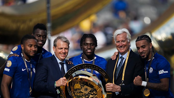 Co-owner Todd Boehly (third from the left) posing with the Club World Cup trophy.