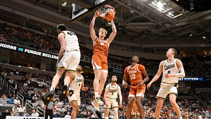 Mar 26, 2026; San Jose, CA, USA; Texas Longhorns center Matas Vokietaitis (8) dunks the ball past Purdue Boilermakers center Oscar Cluff (45) in the first half during a Sweet Sixteen game of the West Regional of the men's 2026 NCAA Tournament at SAP Center. Mandatory Credit: Eakin Howard-Imagn Images Mar 26, 2026; San Jose, CA, USA; Texas Longhorns center Matas Vokietaitis (8) dunks the ball past Purdue Boilermakers center Oscar Cluff (45) in the first half during a Sweet Sixteen game of the West Regional of the men's 2026 NCAA Tournament at SAP Center. Mandatory Credit: Eakin Howard-Imagn Images
