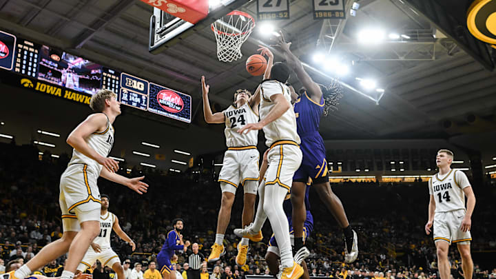 Nov 7, 2025; Iowa City, Iowa, USA; Iowa Hawkeyes guard Tate Sage (24) grabs a rebound as guard Bennett Stirtz (14) and forward Cooper Koch (8) look on against the Western Illinois Leathernecks during the first half at Carver-Hawkeye Arena. Mandatory Credit: Jeffrey Becker-Imagn Images Nov 7, 2025; Iowa City, Iowa, USA; Iowa Hawkeyes guard Tate Sage (24) grabs a rebound as guard Bennett Stirtz (14) and forward Cooper Koch (8) look on against the Western Illinois Leathernecks during the first half at Carver-Hawkeye Arena. Mandatory Credit: Jeffrey Becker-Imagn Images