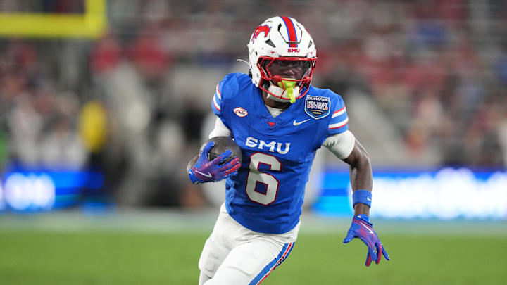 Jan 2, 2026; San Diego, CA, USA; SMU Mustangs running back Chris Johnson Jr. (6) carries the ball against the Arizona Wildcats in the first half during the Holiday Bowl at Snapdragon Stadium. Mandatory Credit: Kirby Lee-Imagn Images