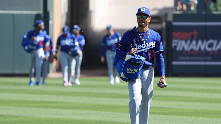 Feb 27, 2025; Salt River Pima-Maricopa, Arizona, USA; Los Angeles Dodgers shortstop Mookie Betts (50) arrives before a spring training game against the Colorado Rockies at Salt River Fields at Talking Stick. Mandatory Credit: Rick Scuteri-Imagn Images Feb 27, 2025; Salt River Pima-Maricopa, Arizona, USA; Los Angeles Dodgers shortstop Mookie Betts (50) arrives before a spring training game against the Colorado Rockies at Salt River Fields at Talking Stick. Mandatory Credit: Rick Scuteri-Imagn Images