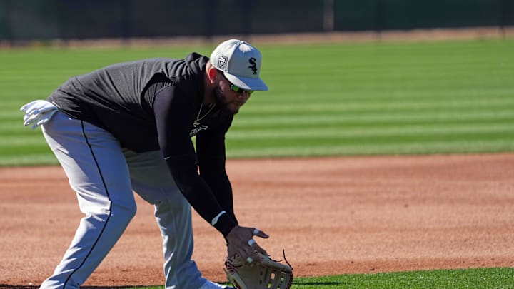 Chicago White Sox third baseman Yoan Moncada (10) fields a ground ball during a Spring Training workout at Camelback Ranch in 2024.