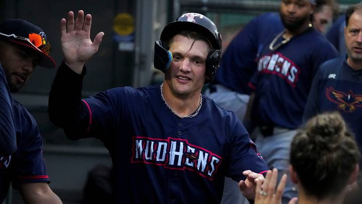 Toledo Mud Hens right fielder Brett Callahan (0) is congratulated after he scores a run. Credit Toledo Mud Hens right fielder Brett Callahan (0) is congratulated after he scores a run. Credit