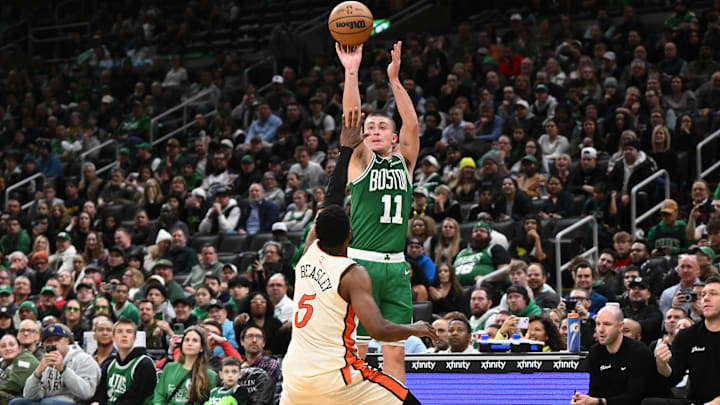 Dec 4, 2024; Boston, Massachusetts, USA; Boston Celtics guard Payton Pritchard (11) attempts a free through against Detroit Pistons guard Malik Beasley (5) during the fourth quarter at the TD Garden. Mandatory Credit: Brian Fluharty-Imagn Images