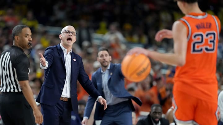 UConn Huskies head coach Dan Hurley gets after his team with Illinois guard Keaton Wagler in the foreground during a Final Four game against the Fighting Illini.