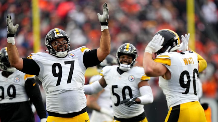Pittsburgh Steelers defensive tackle Cameron Heyward (97) and Pittsburgh Steelers linebacker T.J. Watt (90) celebrate a sack of Cincinnati Bengals quarterback Jake Browning (6) in the fourth quarter of a Week 12 NFL football game between the Pittsburgh Steelers and the Cincinnati Bengals, Sunday, Nov. 26, 2023, at Paycor Stadium.