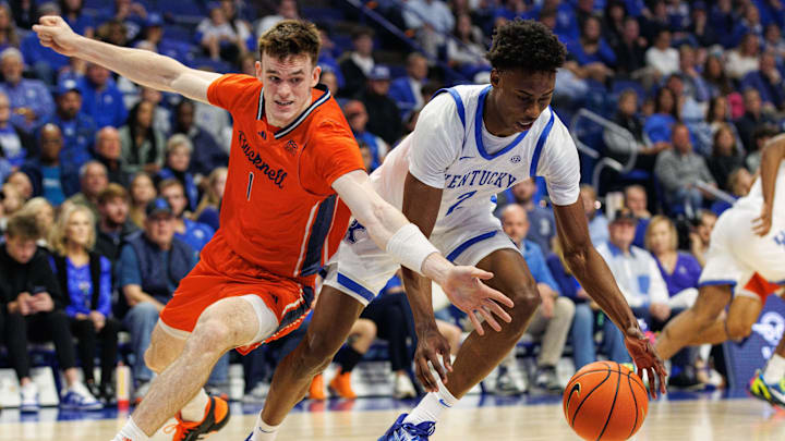 Nov 9, 2024; Lexington, Kentucky, USA; Kentucky Wildcats guard Jaxson Robinson (2) grabs the ball from Bucknell Bison forward Ian Motta (1) during the first half at Rupp Arena at Central Bank Center. Mandatory Credit: Jordan Prather-Imagn Images