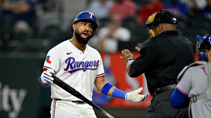 Sep 22, 2026; Arlington, Texas, USA;  Texas Rangers shortstop Ezequiel Duran (20) argues a called strike with home plate umpire Laz Diaz during the ninth inning against the New York Mets at Globe Life Field. Mandatory Credit: Jerome Miron-Imagn Images