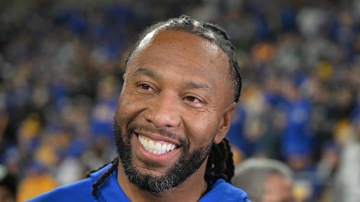 Former Pittsburgh Panthers wide receiver Larry Fitzgerald reacts on the sideline against the Syracuse Orange.