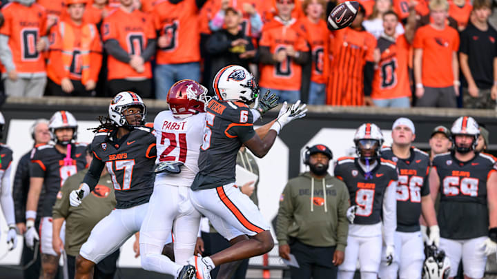 Nov 1, 2025; Corvallis, Oregon, USA; Oregon State Beavers defensive back Jaheim Patterson (6) intercepts a pass intended for Washington State Cougars wide receiver Carter Pabst (21) during the first quarter at Reser Stadium. Mandatory Credit: Craig Strobeck-Imagn Images