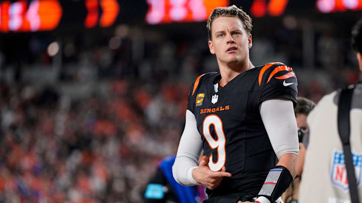Cincinnati Bengals quarterback Joe Burrow (9) celebrates after the game-winning touchdown pass to Tee Higgins in overtime of the NFL Week 17 game between the Cincinnati Bengals and the Denver Broncos at Paycor Stadium in downtown Cincinnati on Saturday, Dec. 28, 2024. The Bengals took a 30-24 win in overtime to remain in the post season chase.