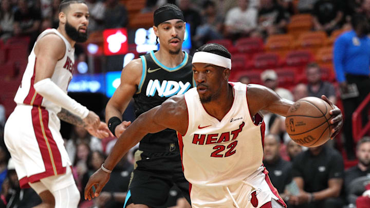 Dec 2, 2023; Miami, Florida, USA;  Miami Heat forward Jimmy Butler (22) grabs a rebound