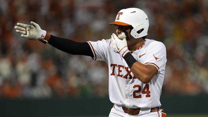 It's hard to tell whether Texas shortstop Adrian Rodriguez is signaling first down, laughing behind his hand or getting ready to hold his nose. Oregon fell 11-3 in Austin at the Super Regional.