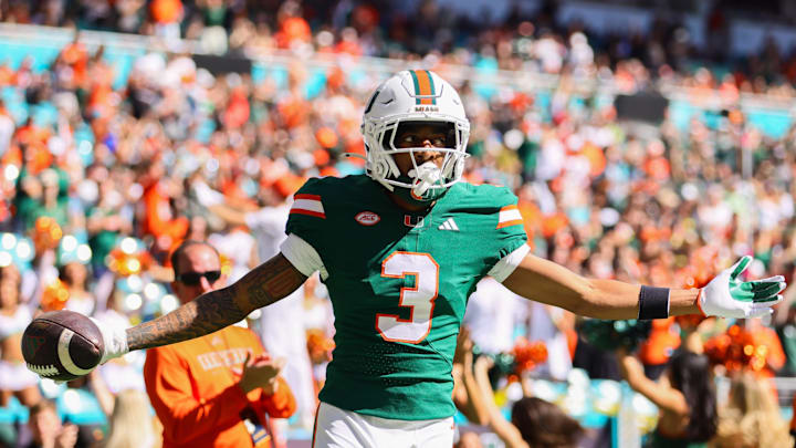 Nov 23, 2024; Miami Gardens, Florida, USA; Miami Hurricanes wide receiver Jacolby George (3) celebrates after scoring a touchdown against the Wake Forest Demon Deacons during the first quarter at Hard Rock Stadium. Mandatory Credit: Sam Navarro-Imagn Images