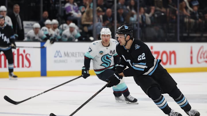 Apr 8, 2025; Salt Lake City, Utah, USA; Utah Hockey Club center Jack McBain (22) skates with the puck against the Seattle Kraken during the third period at Delta Center. Mandatory Credit: Rob Gray-Imagn Images