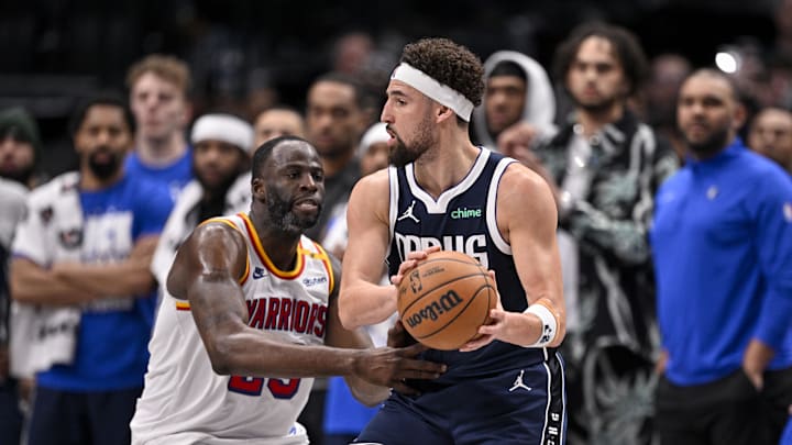 Feb 12, 2025; Dallas, Texas, USA; Golden State Warriors forward Draymond Green (23) and Dallas Mavericks guard Klay Thompson (31) in action during the game between the Dallas Mavericks and the Golden State Warriors at the American Airlines Center. Mandatory Credit: Jerome Miron-Imagn Images