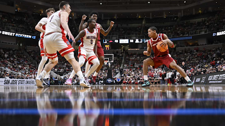 Mar 26, 2026; San Jose, CA, USA; Arkansas Razorbacks guard Darius Acuff Jr. (5) dribbles the ball against Arizona Wildcats guard Jaden Bradley (0) in the second half during a Sweet Sixteen game of the West Regional of the men's 2026 NCAA Tournament at SAP Center. Mandatory Credit: Eakin Howard-Imagn Images Mar 26, 2026; San Jose, CA, USA; Arkansas Razorbacks guard Darius Acuff Jr. (5) dribbles the ball against Arizona Wildcats guard Jaden Bradley (0) in the second half during a Sweet Sixteen game of the West Regional of the men's 2026 NCAA Tournament at SAP Center. Mandatory Credit: Eakin Howard-Imagn Images