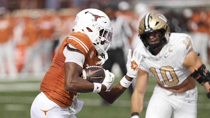 Nov 1, 2025; Austin, Texas, USA; Texas Longhorns wide receiver Ryan Wingo (1) runs for a 75 yard touchdown after catching a pass on the first play of the game against the Vanderbilt Commodores at Darrell K Royal-Texas Memorial Stadium. Mandatory Credit: Scott Wachter-Imagn Images