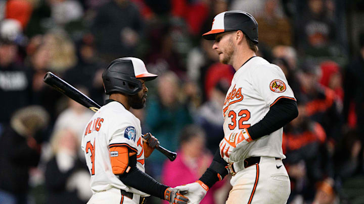 Apr 16, 2025; Baltimore, Maryland, USA; Baltimore Orioles first baseman Ryan O'Hearn (32) and outfielder Cedric Mullins (31) celebrate during the eighth inning against the Cleveland Guardians at Oriole Park at Camden Yards. Mandatory Credit: Reggie Hildred-Imagn Images