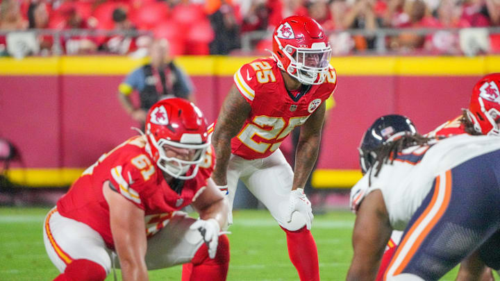 Aug 22, 2025; Kansas City, Missouri, USA; Kansas City Chiefs running back Elijah Mitchell (25) at the line of scrimmage against the Chicago Bears during the game at GEHA Field at Arrowhead Stadium. Mandatory Credit: Denny Medley-Imagn Images