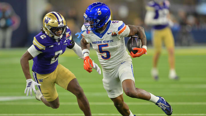 Dec 13, 2025; Inglewood, CA, USA;  Boise State Broncos wide receiver Chris Marshall (5) is stopped by Washington Huskies safety Rahshawn Clark (2) after a complete pass and first down in the second half of the LA Bowl at SoFi Stadium. Mandatory Credit: Jayne Kamin-Oncea-Imagn Images