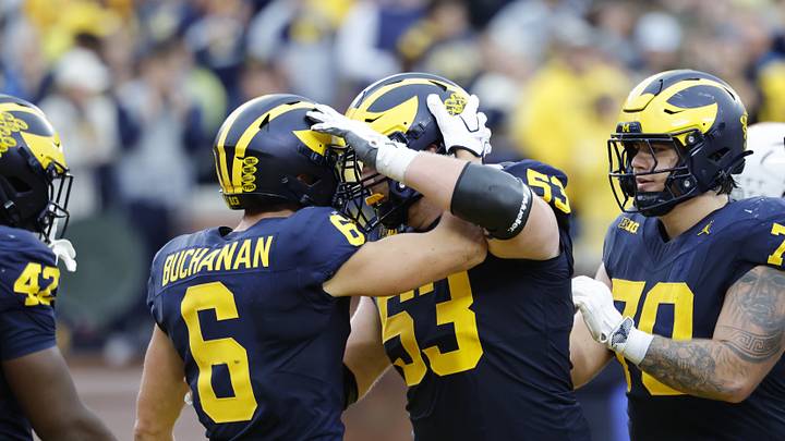 Sep 19, 2026; Ann Arbor, Michigan, USA;  Michigan Wolverines wide receiver JJ Buchanan (6) celebrates his 21-yard touchdown reception with offensive lineman Jake Guarnera (53) during the second quarter against the Texas El Paso Miners at Michigan Stadium.  Mandatory Credit: Rick Osentoski-Imagn Images