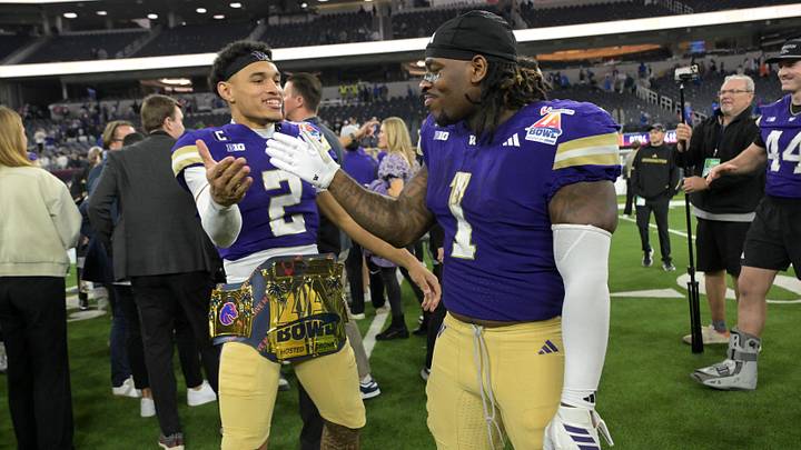 Dec 13, 2025; Inglewood, CA, USA;  Washington Huskies quarterback Demond Williams Jr. (2) and Washington Huskies running back Jonah Coleman (1) celebrate after defeating the Boise State Broncos in the LA Bowl at SoFi Stadium. Mandatory Credit: Jayne Kamin-Oncea-Imagn Images