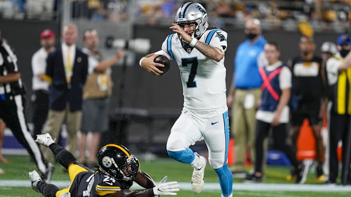 Carolina Panthers quarterback Will Grier (7) jumps out of reach of Pittsburgh Steelers safety Lamont Wade 
