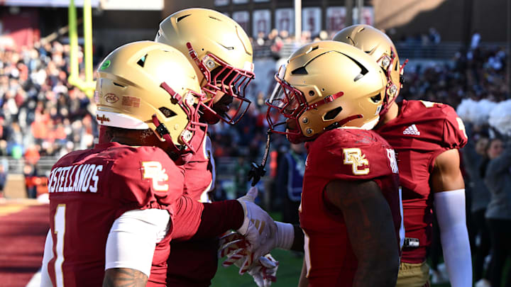 Nov 9, 2024; Chestnut Hill, Massachusetts, USA; Boston College Eagles running back Kye Robichaux (5) celebrates with quarterback Thomas Castellanos (1) after scoring a touchdown against the Syracuse Orange during the first half at Alumni Stadium. Mandatory Credit: Brian Fluharty-Imagn Images